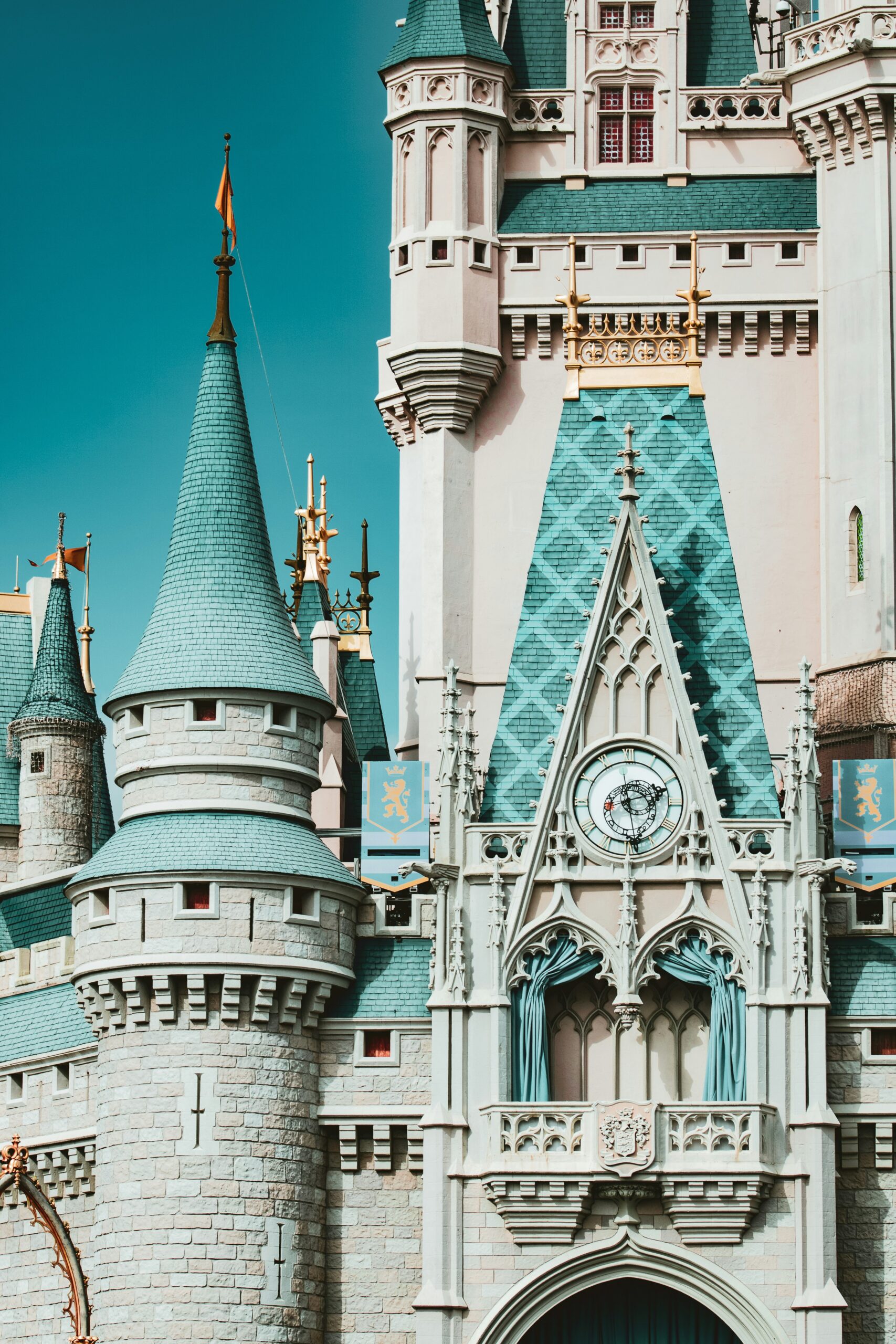 Pastel pink and blue Cinderella Castle, Disney World during the day.